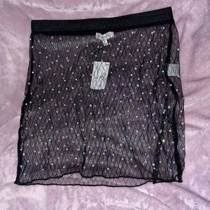 Sheer skirt with rhinestones.